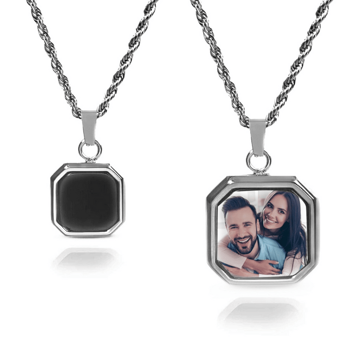 Close-up of a custom photo necklace featuring a unique pendant that heats up when touched, showcasing a personalized image encased in a sleek, modern design