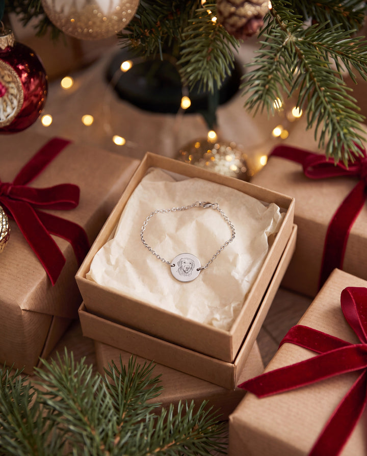 Pet portrait chain bracelet in a gift box under a Christmas tree