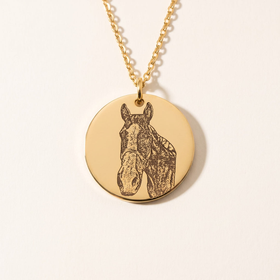 round pet photo necklace with an engraved pet portrait, gold tone