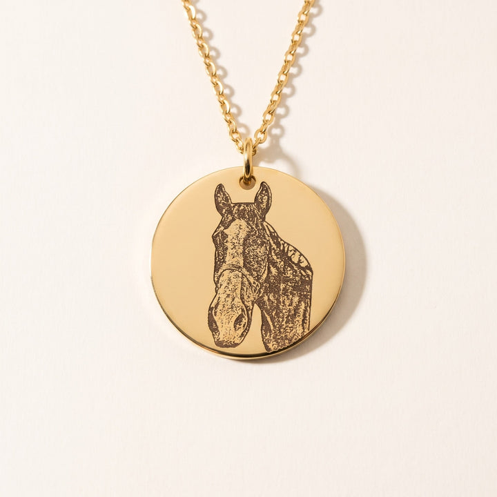 round pet photo necklace with an engraved pet portrait, gold tone