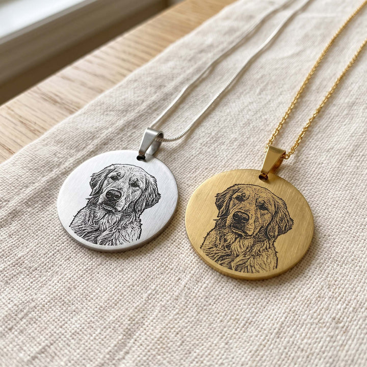 round pet photo necklace with an engraved pet portrait, silver and gold side by side