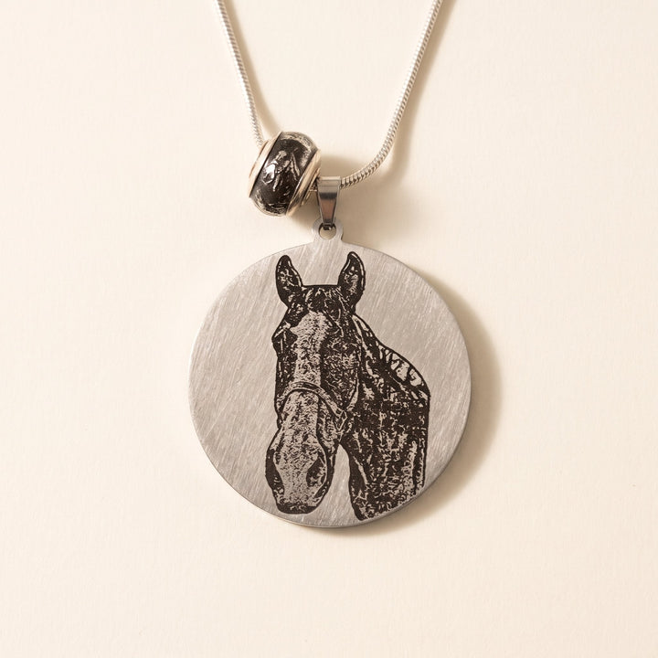 round pet photo necklace with an engraved pet portrait, silver tone
