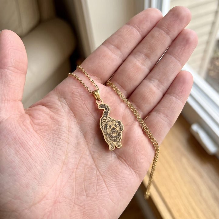 custom pet photo necklace engraved from your photo, held in a hand to show true size