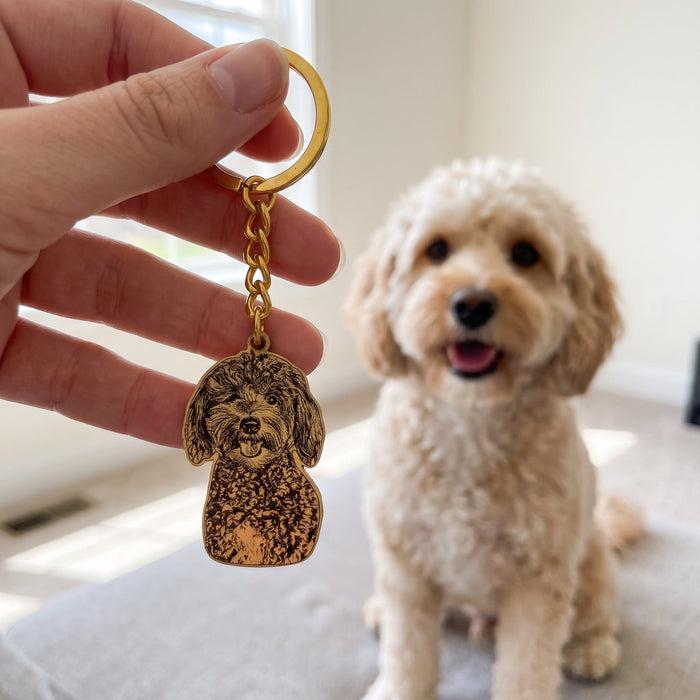 Engraved keychain held in front of the dog it was made from