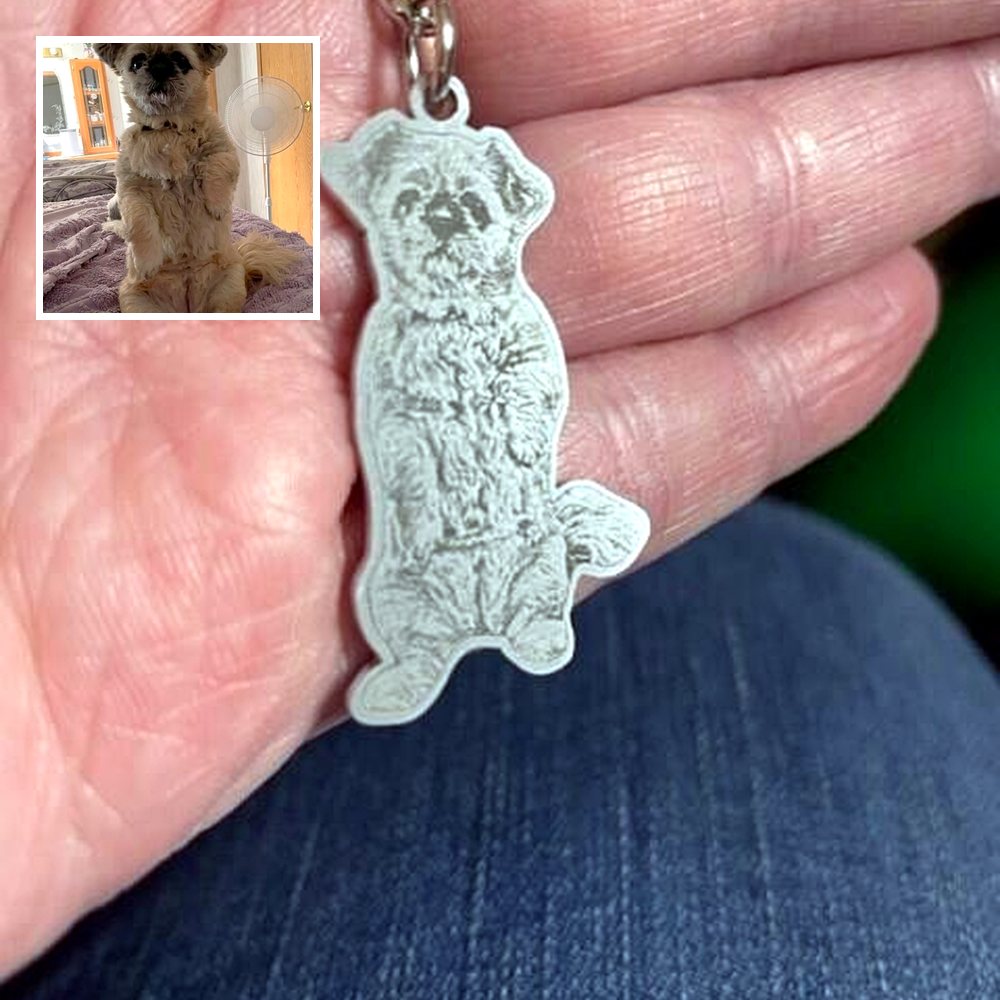 Engraved Shih Tzu keychain in a customer's hand, with the photo of Baby it was made from