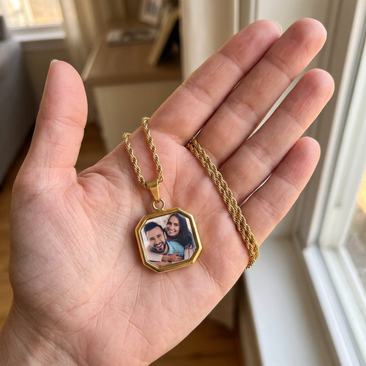 heat activated photo necklace, held in a hand to show true size