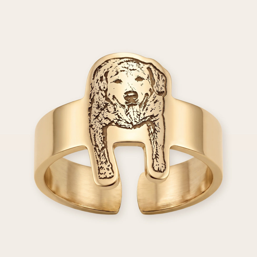 Engraved pet photo ring, gold tone, on a plain background