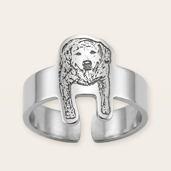 Engraved pet photo ring, silver tone, on a plain background