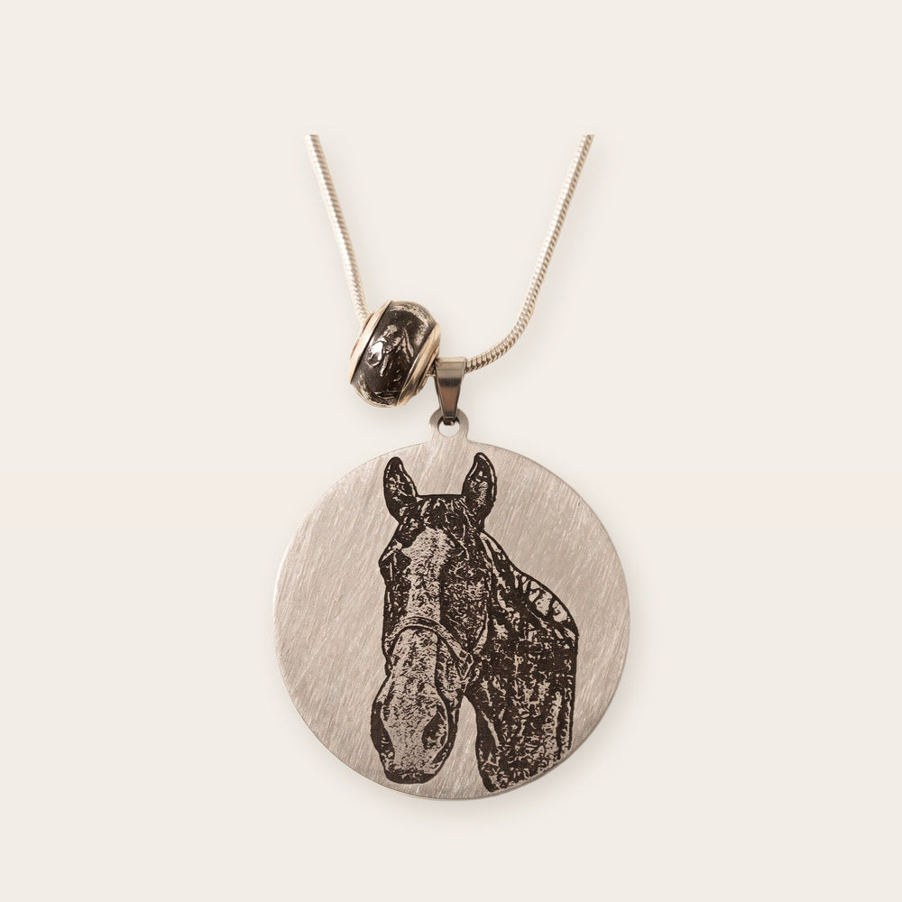 Round pet photo necklace, silver tone, on a plain background