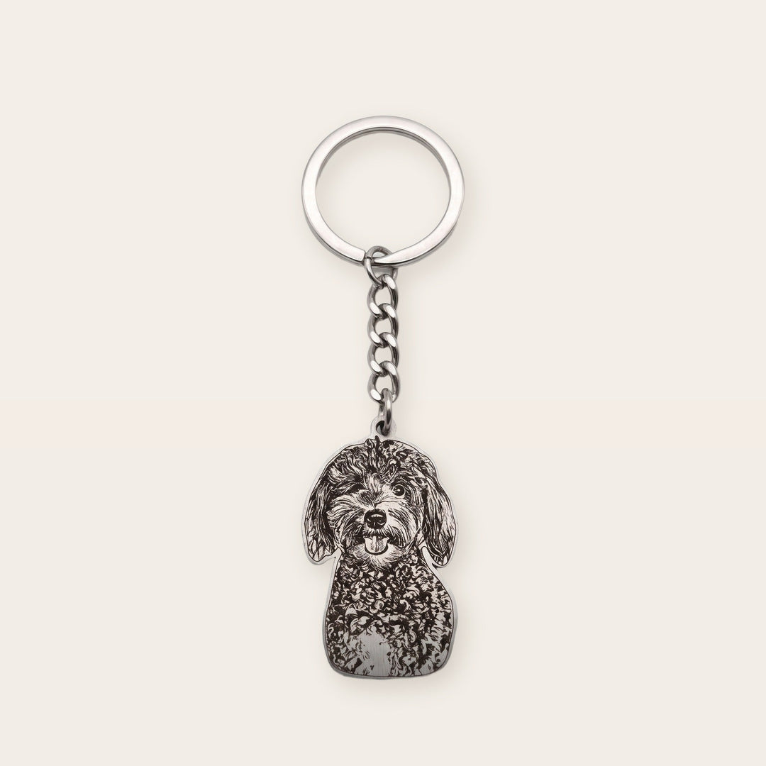 Pet memorial photo keychain, silver tone, on a plain background
