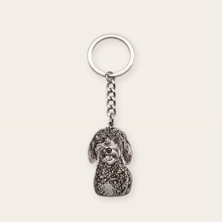 Pet memorial photo keychain, silver tone, on a plain background