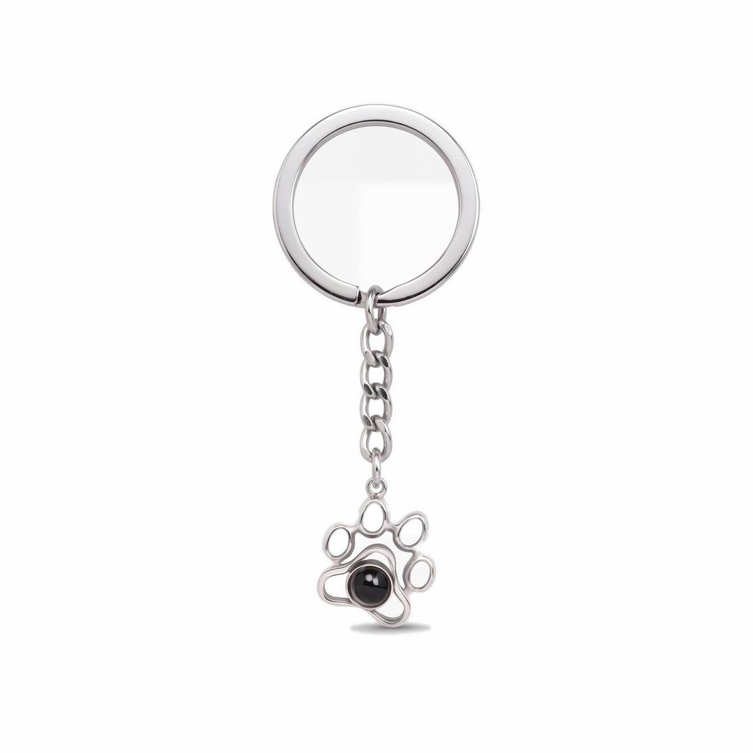 Silver paw print projection keychain