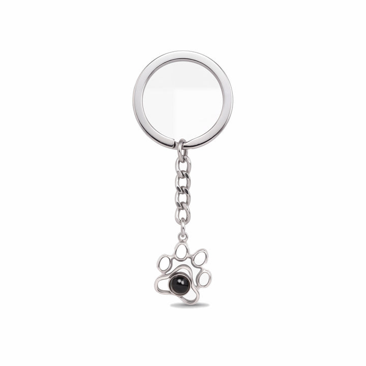 Silver paw print projection keychain