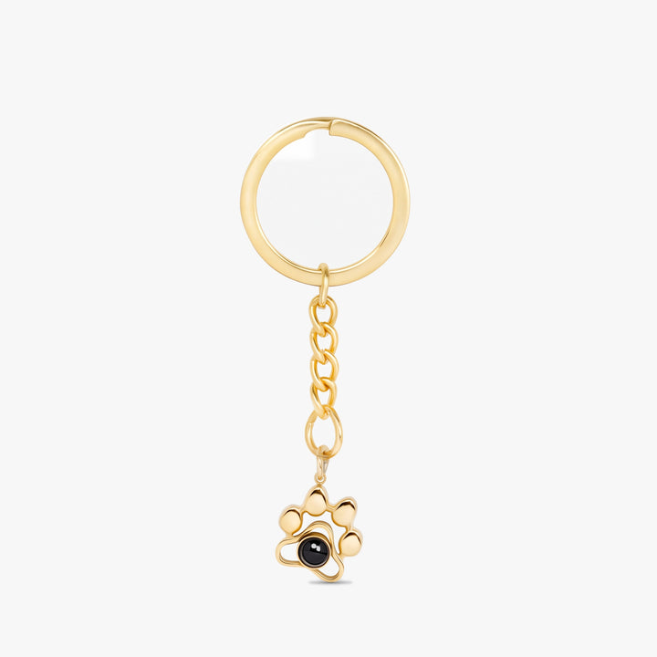 Gold paw print projection keychain