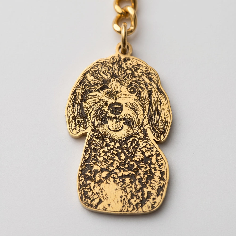 Close-up of the laser engraving on a pet portrait keychain