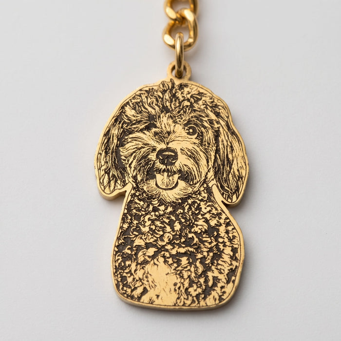 Close-up of the laser engraving on a pet portrait keychain