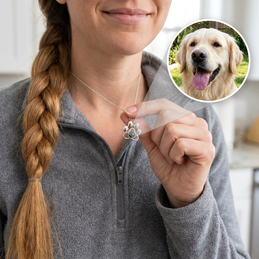 Silver paw print projection necklace with a dog photo inside