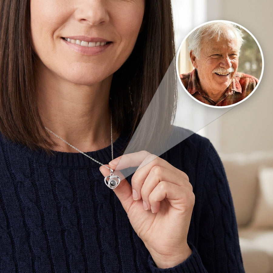 Silver heart projection necklace with a photo of her late father inside