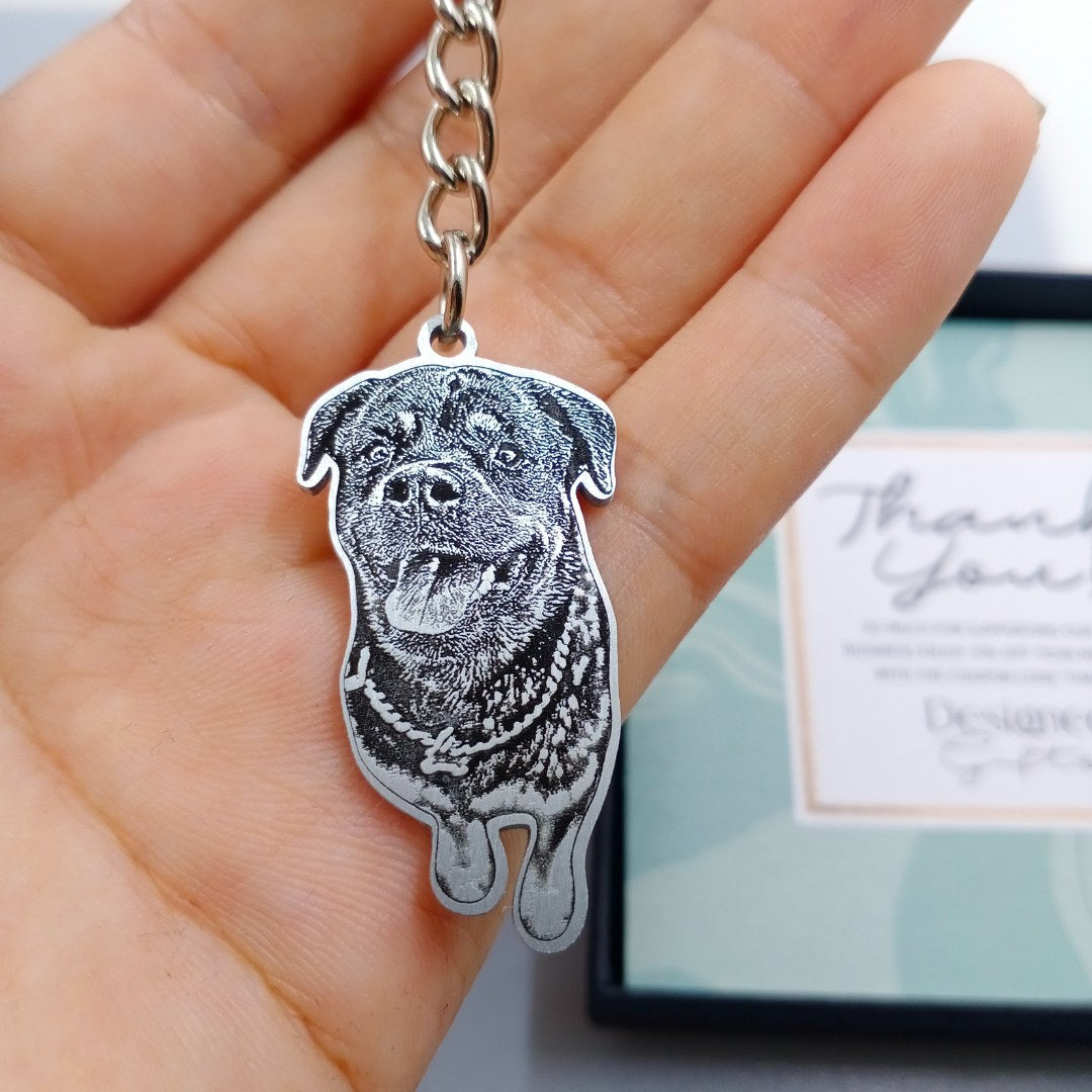 Real pet photo keychain with a rottweiler portrait, held in hand