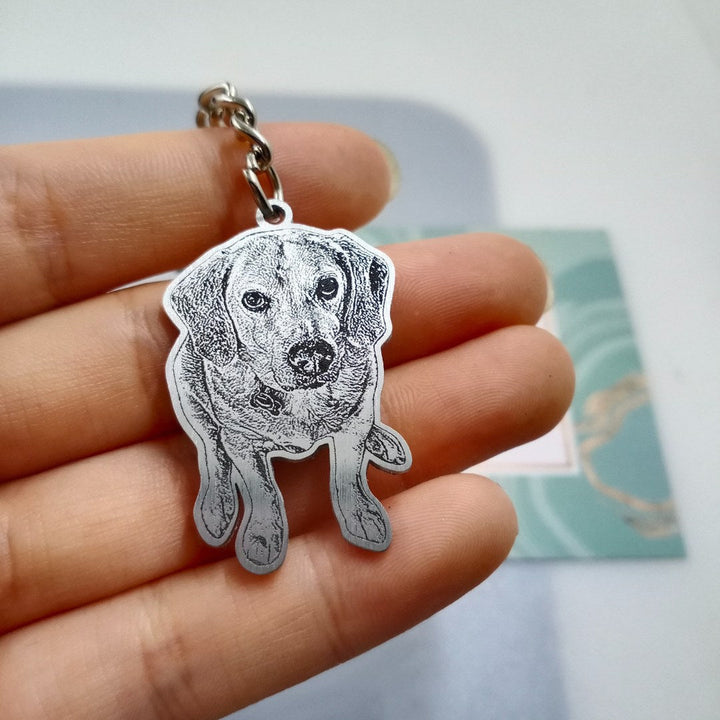 Real pet photo necklace with a beagle portrait, held in hand