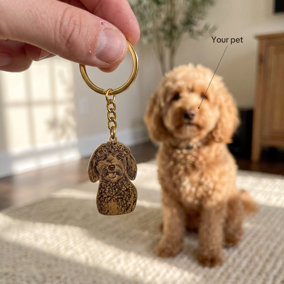 Gold custom pet photo keychain held up in front of the dog it shows
