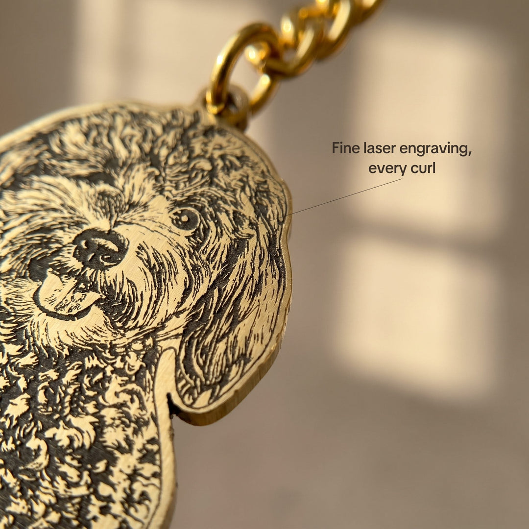 Close-up of the fine laser engraving on a dog portrait keychain