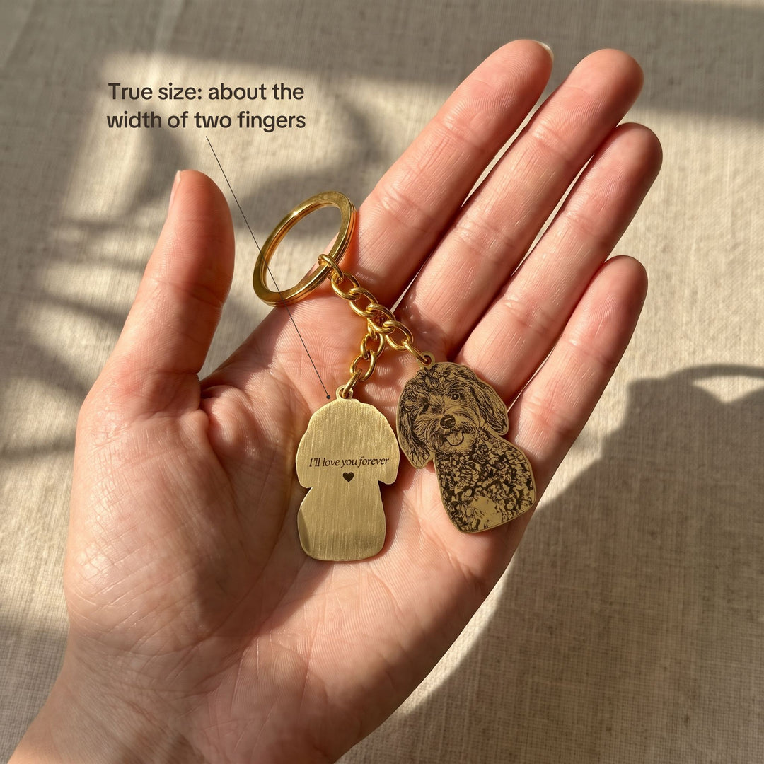 Pet photo keychain in an open hand showing its true size